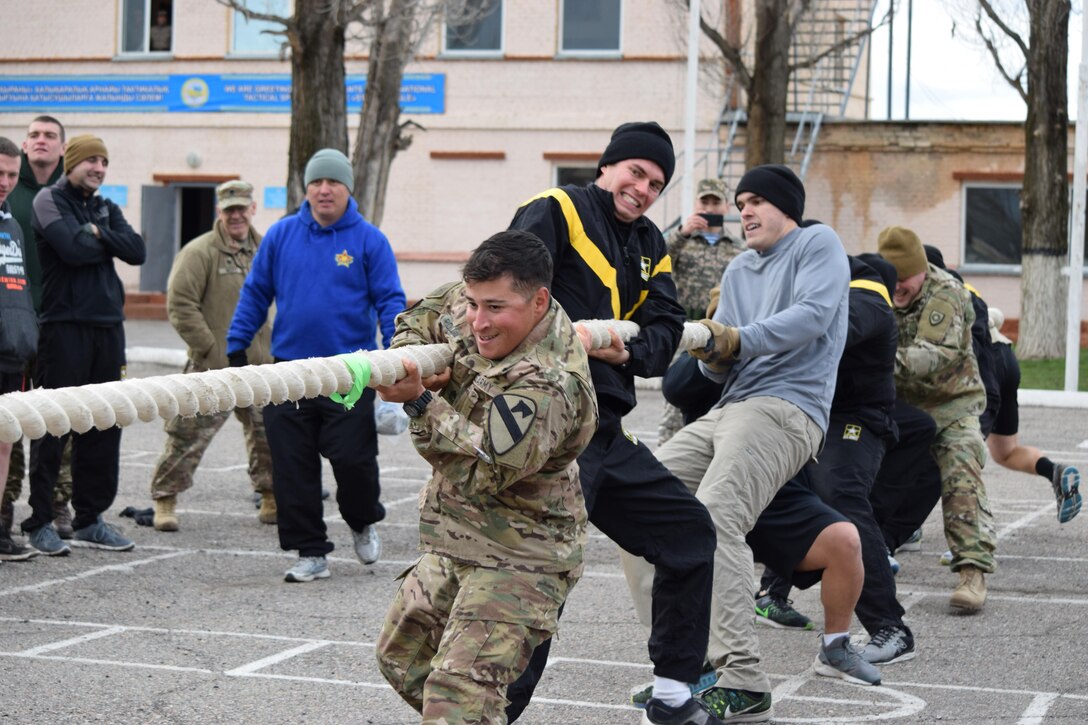 U.S. Army Soldiers participate in a tug-o-war competition after a day of military-to-military engagements with U.K. and Kazakhstani soldiers Apr. 4, 2017, as part of Steppe Eagle Koktem at Illisky Training Center, Kazakhstan.