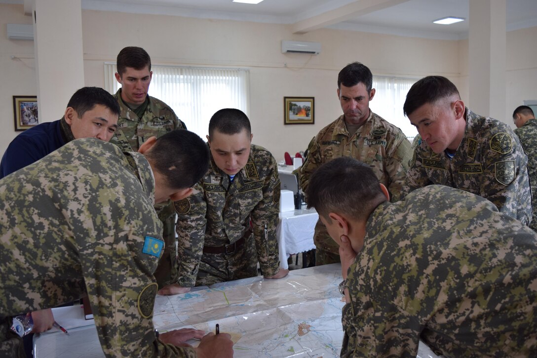 Kazakhstani soldiers and U.S. Army Soldiers develop a concept of the operation sketch for Steppe Eagle Koktem during a military-to-military engagement focused on planning at the company level Apr. 4, 2017, at Illisky Training Center, Kazakhstan. Steppe Eagle Koktem is a series of engagements that occur simultaneously and prepare soldiers for Exercise Steppe Eagle in July.