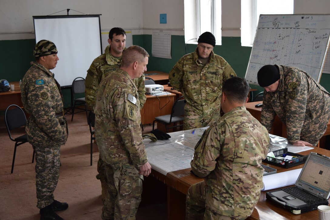 U.S. Army Soldiers work with Kazakhstani Soldiers from the Kazakhstan Peacekeeping Brigade to develop operational products for Steppe Eagle Koktem Apr. 4, 2017, at Illisky Training Center, Kazakhstan. Steppe Eagle Koktem focuses on a series of military-to-military engagements, including planning, in prepartion for Exercise Steppe Eagle later in the year.
