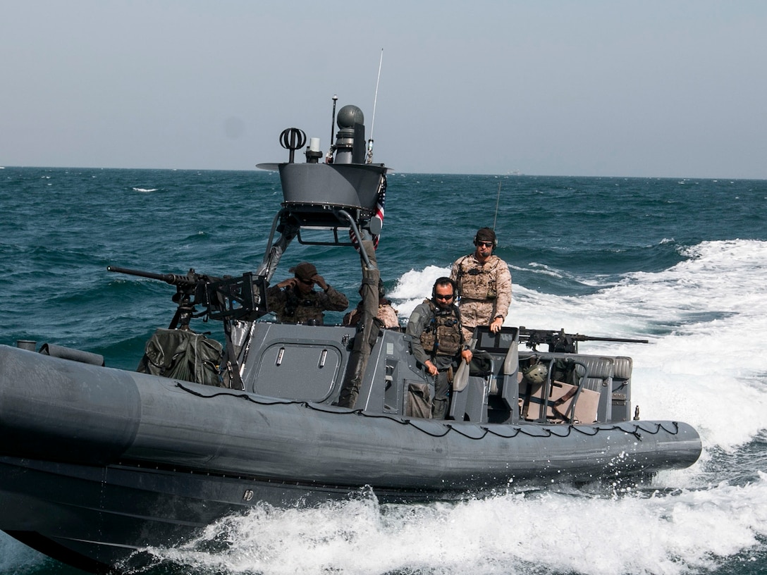 Members of the Navy's Special Boat Team ride up to pick up the  Soldiers from the 3rd Battalion, 8th Cavalry Regiment, 3rd Armored Brigade Combat Team, 1st Cavalry Division and transport them to an oil tanker somewhere in the Persian Gulf. Soldiers from Co. B, 3-8 CAV played the opposing force for a joint training exercise, called Eagle Resolve, between U.S. special operations forces and SOF elements from Qatar, Kuwait, Saudi Arabia, and United Arab Emirates. (U.S. Army photo by Staff Sgt. Leah R. Kilpatrick, 3rd Armored Brigade Combat Team Public Affairs Office, 1st Cavalry Division (released)