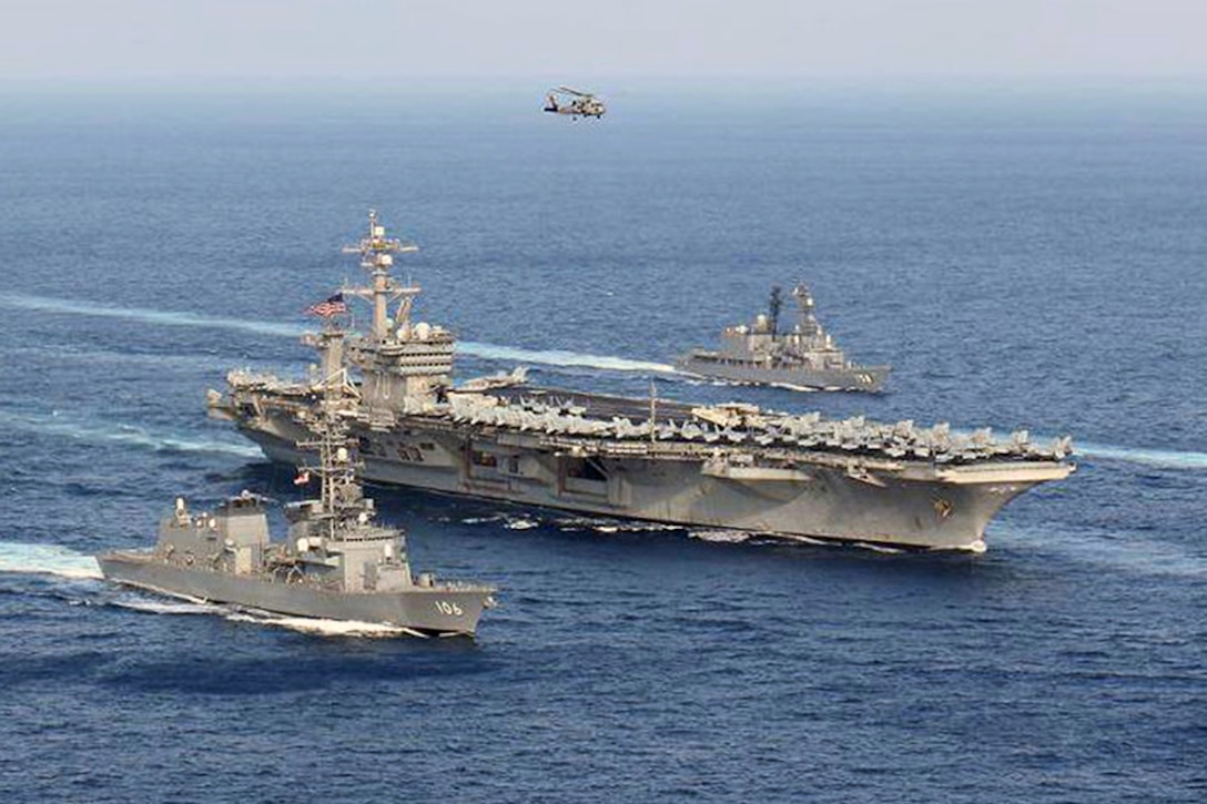 USS Carl Vinson and Japan Maritime Self-Defense Force ships steam in formation at the conclusion of a bilateral exercise to increase proficiency in basic maritime skills and improve response capabilities, Mar. 29, 2017. The Carl Vinson is on a regularly scheduled Western Pacific deployment. Japan Maritime Self-Defense Force photo