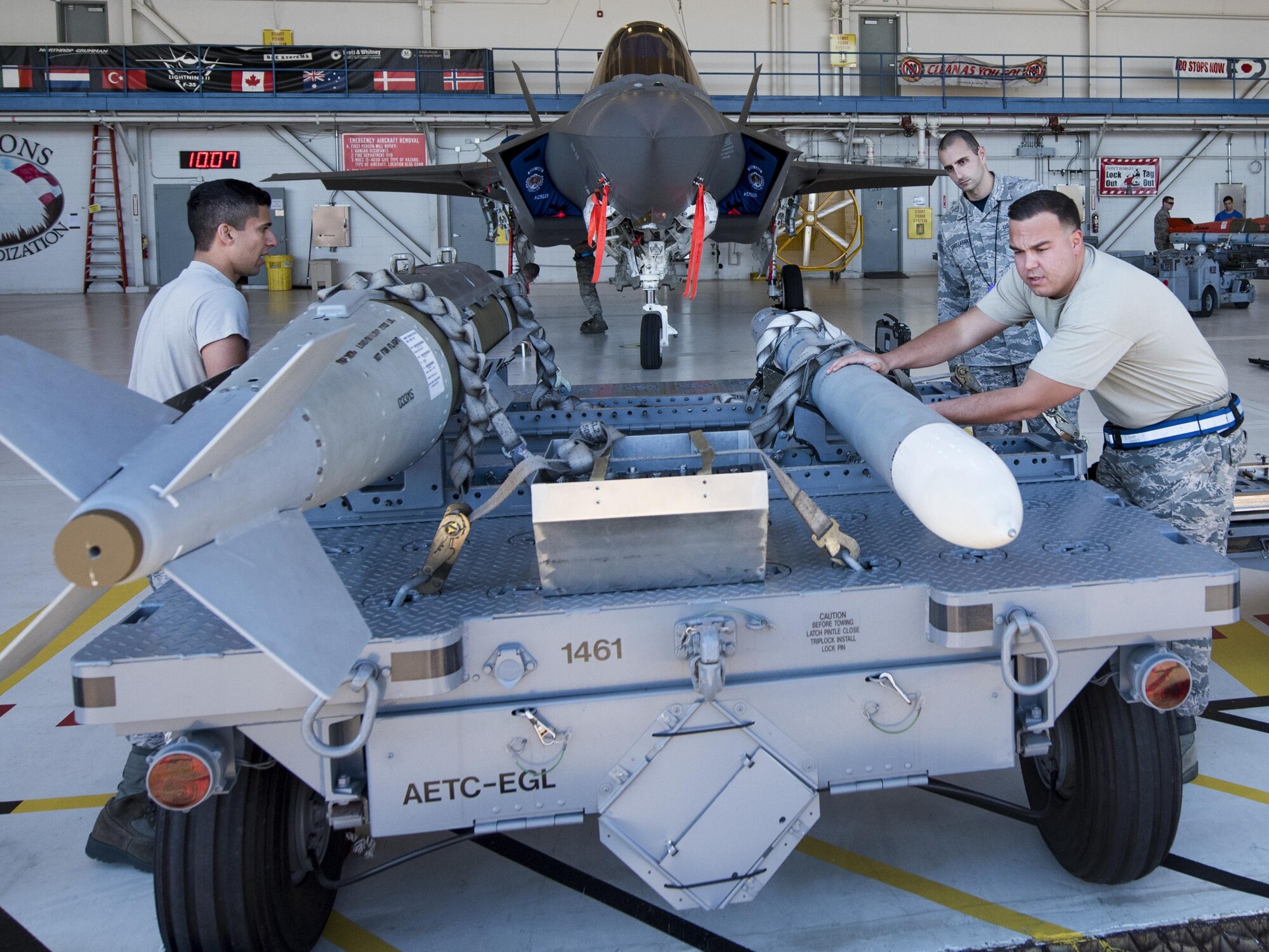 The 33rd Aircraft Maintenance Squadron’s Airmen perform checks on a guided-bomb-unit-31 and AIM-120 missile prior to loading them on their F-35 during the Team Eglin weapons load competition April 7 at Eglin Air Force Base, Fla.  Teams from the 33rd Fighter Wing and 96th Test Wing competed to see who could load up two weapons onto their designated aircraft the quickest and with the fewest errors.  The 33rd FW team repeated as base champion.  (U.S. Air Force photo/Samuel King Jr.)