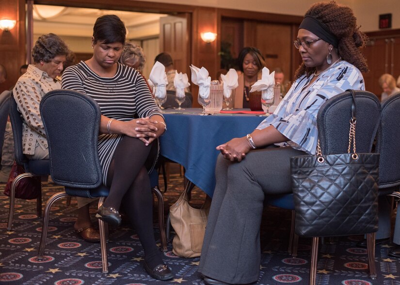 National Prayer Luncheon attendees pray at Joint Base Andrews, Md., April 4, 2017. The event consisted of group prayer, a meal, music by the U.S. Air Force Band, and a speech made by Brig. Gen. J. Steven Chisolm, Air National Guard Assistant to the U.S. Air Force Chief of Chaplains. Chisolm spoke about the importance of spiritual fitness to a healthy lifestyle. (U.S. Air Force photo by Senior Airman Jordyn Fetter)