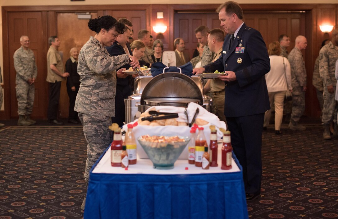 National Prayer Luncheon attendees collect food from a buffet at Joint Base Andrews, Md., April 4, 2017. The event consisted of group prayer, a meal, music by the U.S. Air Force Band, and a speech made by Brig. Gen. J. Steven Chisolm, Air National Guard Assistant to the U.S. Air Force Chief of Chaplains. (U.S. Air Force photo by Senior Airman Jordyn Fetter)