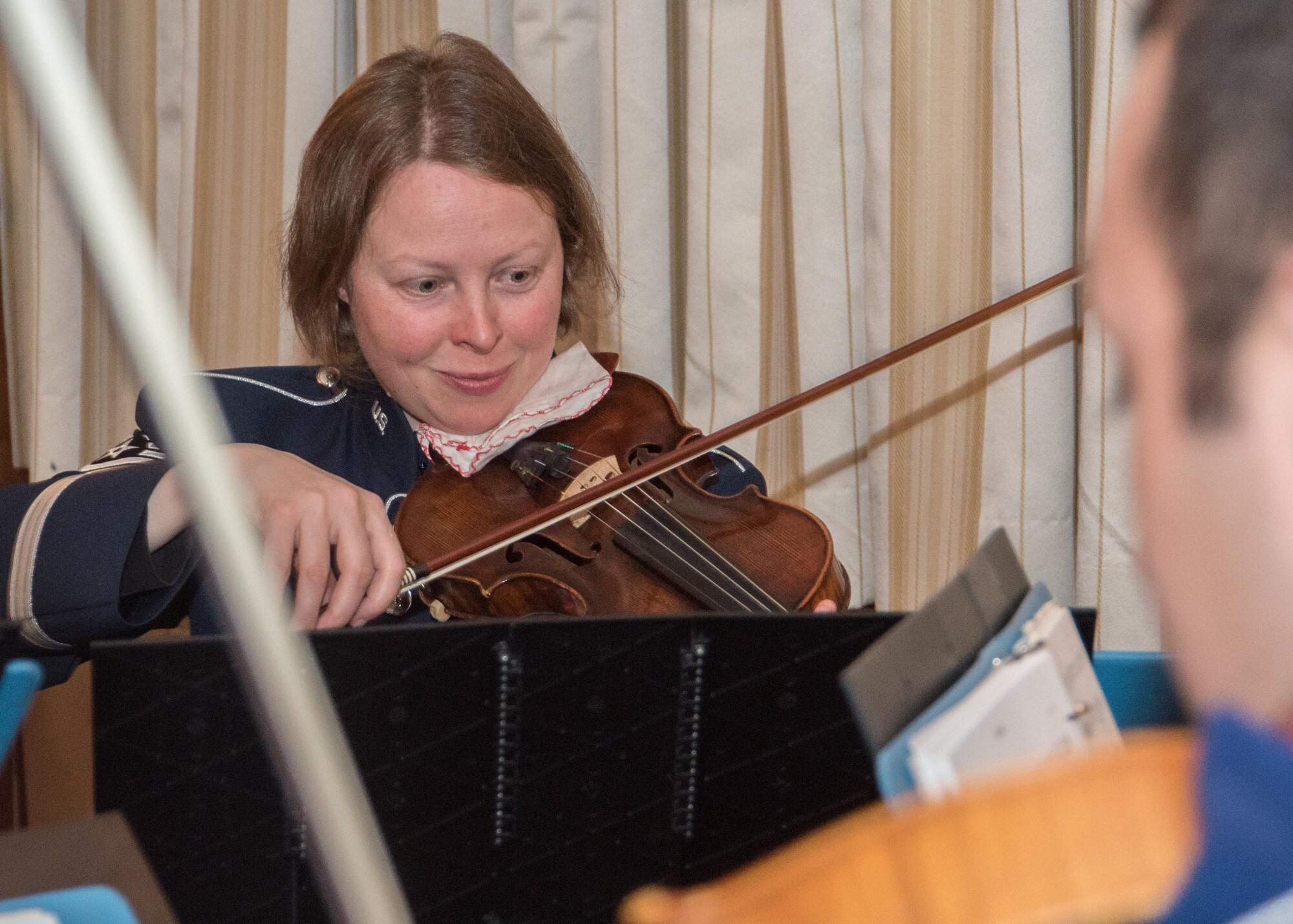 Tech. Sgt. Emily Barnes, U.S. Air Force Band violinist, performs during the annual National Prayer Luncheon at Joint Base Andrews, Md., April 4, 2017. The event consisted of group prayer, a meal, music by the U.S. Air Force Band, and a speech made by Brig. Gen. J. Steven Chisolm, Air National Guard Assistant to the U.S. Air Force Chief of Chaplains. Chisolm spoke about the importance of spiritual fitness to a healthy lifestyle. (U.S. Air Force photo by Senior Airman Jordyn Fetter)