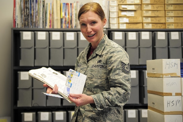 Tech. Sgt. Brooke Howells, 315th Airlift Wing historian, sorts through letters from past comanders April 8, 2017 at Joint Base Charleston, S.C. (U.S. Air Force photo by Senior Airman Jonathan Lane)
