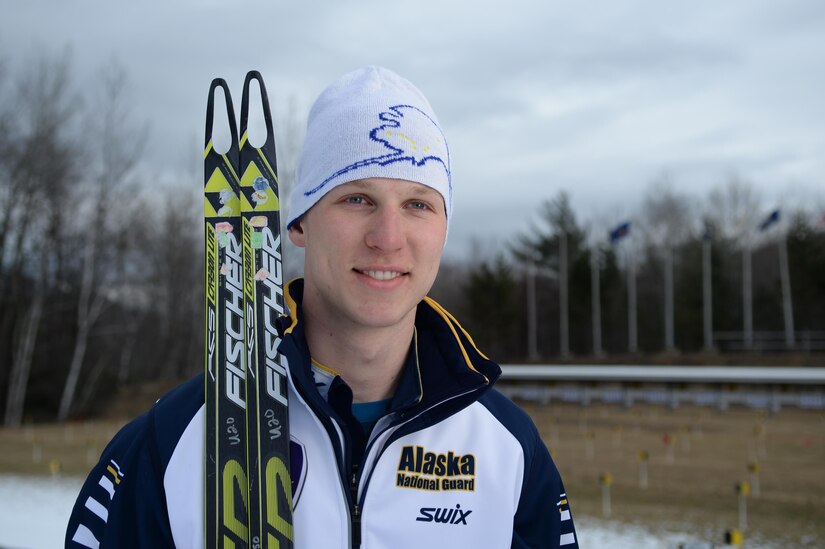 Army Pfc. Travis Cooper of the Alaska National Guard holds his cross-country skis during the National Guard Biathlon Championships at Camp Ethan Allen, Vt., March 7, 2017. Army photo by Sgt. Jose A. Torres Jr.