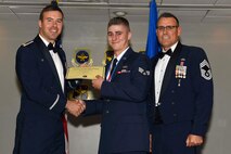 U.S. Air Force Reserve Maj. Grady Dieckert, commander, 913th Operations Support Squadron, Senior Airman Casey Godwin, aircrew flight equipment, 913th Maintenance Squadron, and Chief Master Sgt. Ralph Babcock III, superintendent, 913th Aircraft Maintenance Squadron, pose for a photo during the Airman Leadership School (ALS) graduation ceremony at Little Rock Air Force Base, Ark., April 6, 2017. ALS is an Air Force education program held at base level to prepare senior Airmen for positions of greater responsibility. The course teaches leadership skills required of supervisors and reporting officials throughout the Air Force. (U.S. Air Force photo by Airman 1st Class Kevin Sommer Giron)