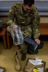 US Army Reserve 1st Lt. Zachary Daugherty, and intelligence officer with the 325th Tactical Psychological Operations Company (Airborne), 2nd Psychological Operations Group, examines and ensures the fit of a cold weather boot insert prior to issue at the Fort McCoy, Wis. Central Issue Facility in preparation for training and qualification during Operation Cold Steel, April 03, 2017. The 2nd Psychological Operations Group combines regional and trans-regional expertise, political-military awareness and cross-cultural communication skills to conduct and support civil-military operations for conventional and special operations forces. Operation Cold Steel is the U.S. Army Reserve’s crew-served weapons qualification and validation exercise to ensure that America’s Army Reserve units and Soldiers are trained and ready to deploy on short-notice and bring combat-ready, lethal firepower in support of the Army and our joint partners anywhere in the world. (U.S. Army Reserve photo by Spc. Jeremiah Woods, 358th Public Affairs Detachment / Released)