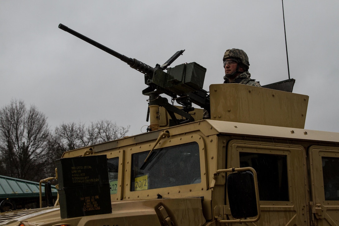 A tactical vehicle mounted with an M2 .50 caliber machine gun receives ammunition in preparation for  a live fire exercise at Range 26 on Fort McCoy, Wis., during Operation Cold Steel, April 03, 2017. Operation Cold Steel is the U.S. Army Reserve’s crew-served weapons qualification and validation exercise to ensure that America’s Army Reserve units and Soldiers are trained and ready to deploy on short-notice and bring combat-ready, lethal firepower in support of the Army and our joint partners anywhere in the world. (U.S. Army Reserve photo by Spc. Jeremiah Woods, 358th Public Affairs Detachment / Released)