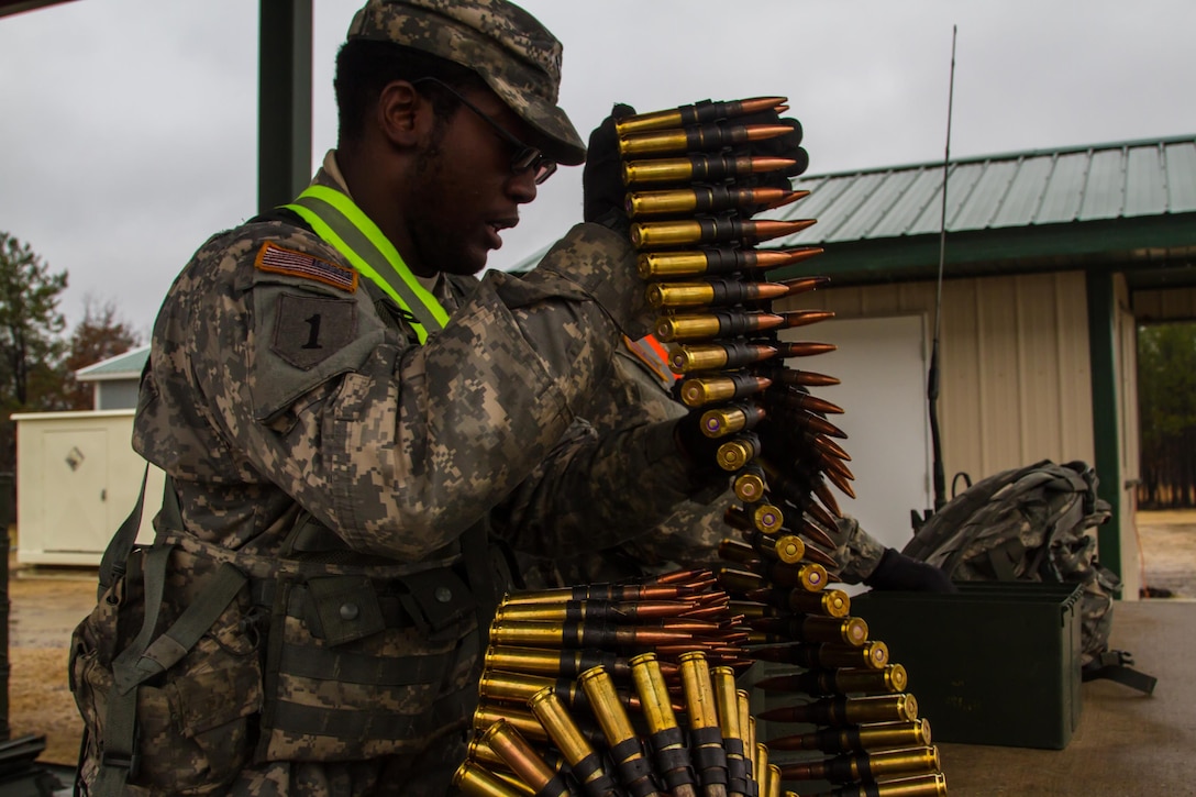 US Army Reserve Spc. Calvin Gray a motor transport operator with the 416th Theater Engineer Command and Pvt. 1st Class Donte Henderson a power generation equipment repairer with the 354th civil affairs company, 351st Civil Affairs Command prep .50 caliber machine gun ammunition to be given to the firing teams during a live fire exercise at Range 26 on Fort McCoy, Wis., for Operation Cold Steel, April 03, 2017. Operation Cold Steel is the U.S. Army Reserve’s crew-served weapons qualification and validation exercise to ensure that America’s Army Reserve units and Soldiers are trained and ready to deploy on short-notice and bring combat-ready, lethal firepower in support of the Army and our joint partners anywhere in the world. (U.S. Army Reserve photo by Spc. Jeremiah Woods, 358th Public Affairs Detachment / Released)