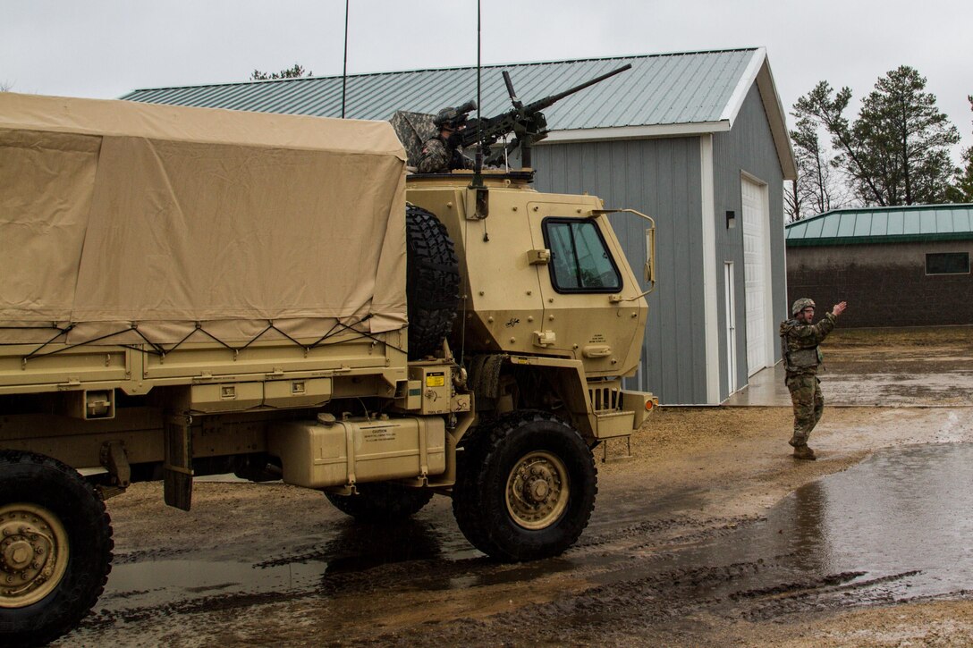 A tactical vehicle mounted with an M2 .50 caliber machine gun is guided to a staging area after a live fire exercise at Range 26 on Fort McCoy, Wis., during Operation Cold Steel, April 03, 2017. Operation Cold Steel is the U.S. Army Reserve’s crew-served weapons qualification and validation exercise to ensure that America’s Army Reserve units and Soldiers are trained and ready to deploy on short-notice and bring combat-ready, lethal firepower in support of the Army and our joint partners anywhere in the world. (U.S. Army Reserve photo by Spc. Jeremiah Woods, 358th Public Affairs Detachment / Released)