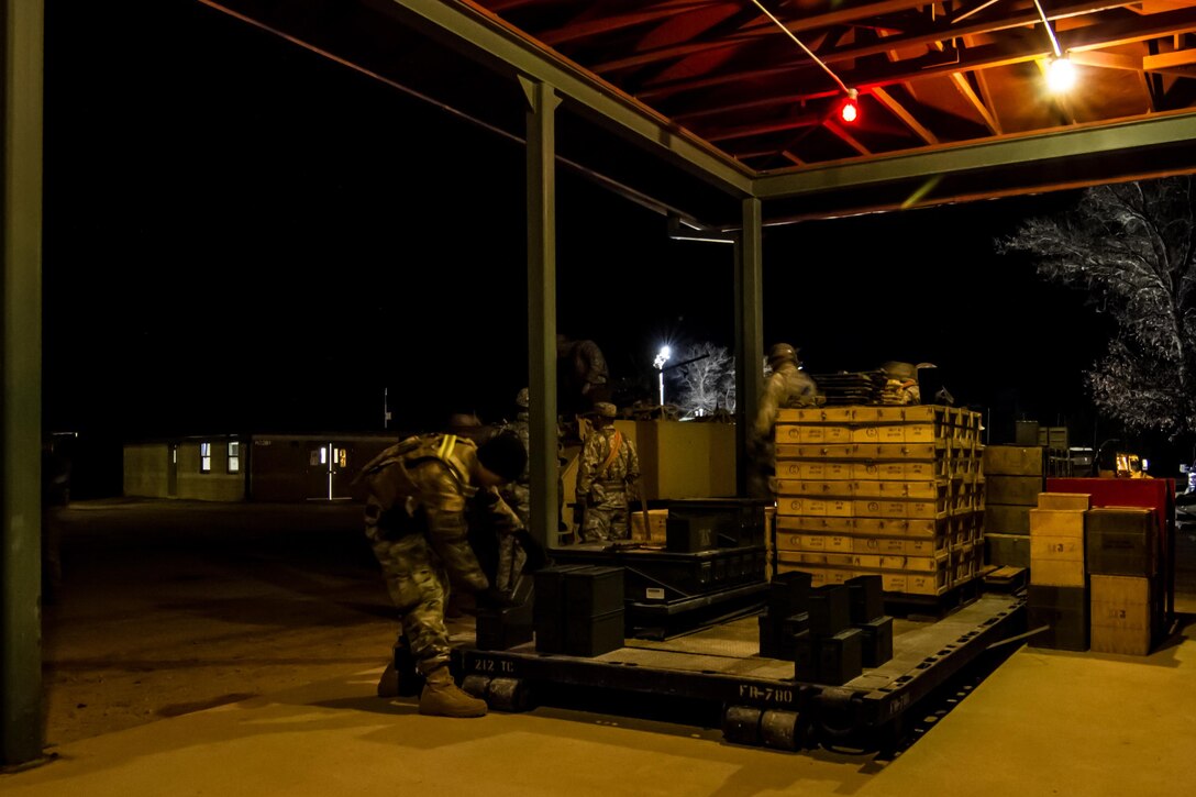 Cadre at the ammunition point distribute live rounds to a gun crew prior to a night-fire qualification as part of Operation Cold Steel at Fort McCoy, Wis., April 04, 2017. Operation Cold Steel is the U.S. Army Reserve’s crew-served weapons qualification and validation exercise to ensure that America’s Army Reserve units and Soldiers are trained and ready to deploy on short-notice and bring combat-ready, lethal firepower in support of the Army and our joint partners anywhere in the world. (U.S. Army Reserve photo by Spc. Jeremiah Woods, 358th Public Affairs Detachment / Released)