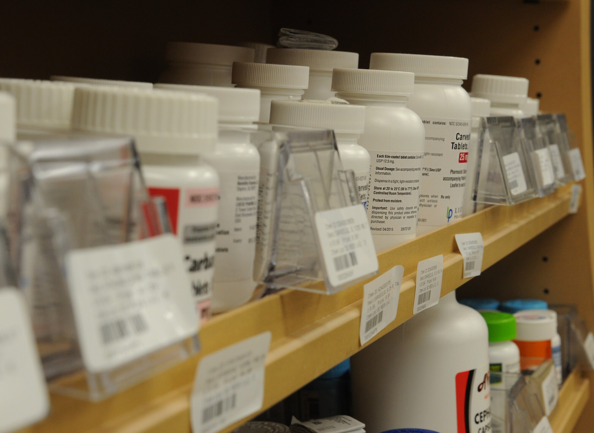 Medication sits on shelves at the Keesler Medical Center Inpatient Pharmacy March 22, 2017, on Keesler Air Force Base, Miss. As part of the Defense Health Agency’s Readmission Pilot Program, the 81st Medical Group is ensuring patients understand their medication regimen by having one-on-one sessions at discharge with a goal of driving down the readmittance rate for high-risk patients. (U.S. Air Force photo by Senior Airman Holly Mansfield)