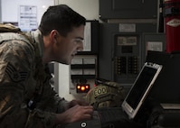 Staff Sgt. Steven Holbrook, 5th Civil Engineer Squadron explosive ordnance disposal team member, reviews mission-related information at Minot Air Force Base, N.D., March 28, 2017. Unexploded ordnance recovery operations is one of the 10 mission-areas executed by EOD Airmen. (U.S. Air Force photo/Airman 1st Class Alyssa M. Akers)