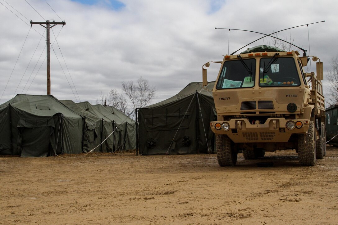A tactical vehicle is parked in front of tents on Range 4 at Fort McCoy, Wis., during Operation Cold Steel on March 31, 2017. Operation Cold Steel is the U.S. Army Reserve’s crew-served weapons qualification and validation exercise to ensure that America’s Army Reserve units and Soldiers are trained and ready to deploy on short-notice and bring combat-ready, lethal firepower in support of the Army and our joint partners anywhere in the world. (U.S. Army Reserve photo by Spc. Jeremiah Woods, 358th Public Affairs Detachment / Released)