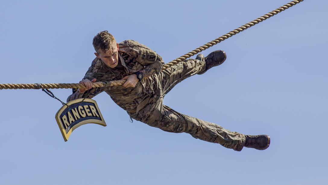 A soldier touches the Ranger tab during the 34th annual Best Ranger Competition at Fort Benning, Ga., Apr. 9, 2017. The three-day event tests competitors' physical, mental and technical capabilities. Army photo by Staff Sgt. Justin P. Morelli