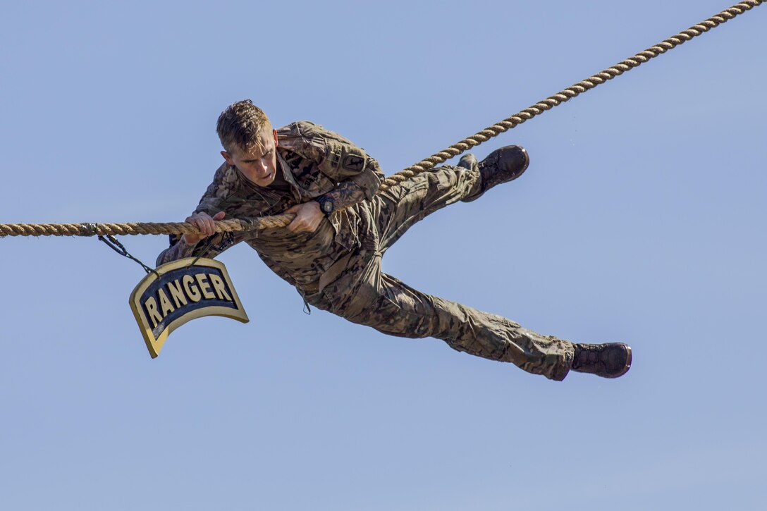 A soldier touches the Ranger tab during the 34th annual Best Ranger Competition at Fort Benning, Ga., Apr. 9, 2017. The three-day event tests competitors' physical, mental and technical capabilities. Army photo by Staff Sgt. Justin P. Morelli