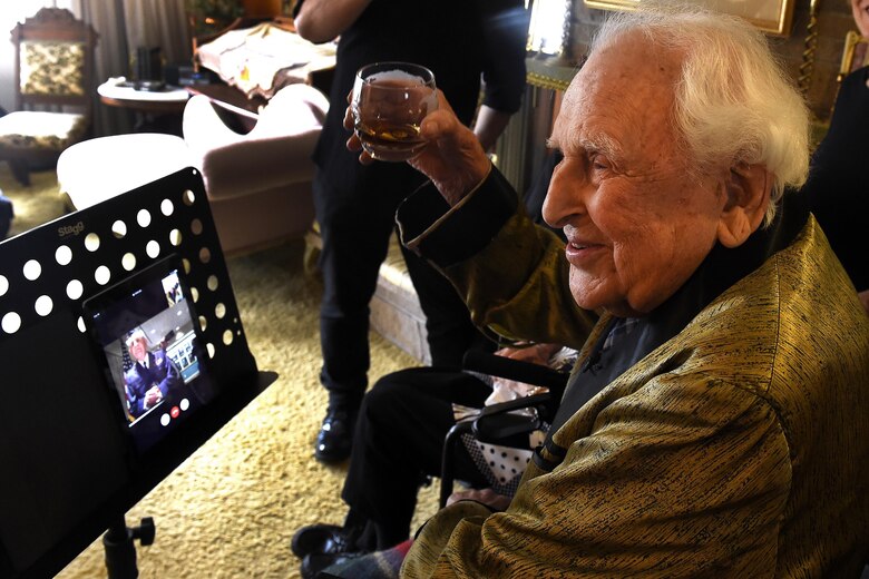 Col. (ret.) Ralph Jenkins (right), World War II 510th Fighter Squadron commander, virtually toasts through the Facetime application, Maj. (ret.) M.E. Johns, former 510th FS aviator, hosted at Vandenberg Air Force Base, California., during a toasting event April 7, 2017.  The two, along with the remaining members of their squadron, made a pact that when the last two members were left they would toast their fallen comrades and Jenkins and Johns made that pact happen with this event. (U.S. Air Force photo/Tech. Sgt. Tim Chacon)
