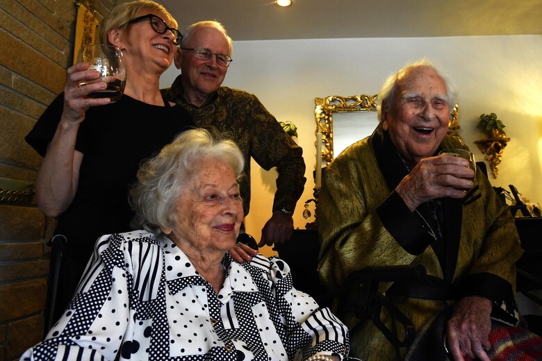 Col. (ret.) Ralph Jenkins (right), World War II 510th Fighter Squadron commander, along with his family at his residence in Seattle, raise a toast to the fallen comrades of the 510th FS, April 7, 2017.  The toast, using two bottle of 1945 Calvados Brandy, were transported across the country as a family member, Col. (United States Marine Corps ret.) Dick Dunnivan, of a deceased 510th squadron member made it happen. (U.S. Air Force photo/Tech. Sgt. Tim Chacon)