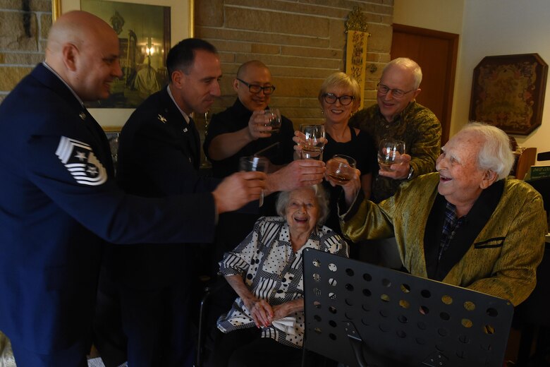 Col. (ret.) Ralph Jenkins (right), World War II 510th Fighter Squadron commander, along with his family and members of the 62nd Airlift Wing, Joint Base Lewis-McChord, Wash., at his residence in Seattle, raise a toast to the fallen comrades of the 510th FS, April 7, 2017. The toast was made possible as Airmen of McChord Field, part of Joint Base Lewis-McChord, Wash., and Airmen of Vandenberg Air Force Base, California worked together to ensure these heroes were reunited. (U.S. Air Force photo/Tech. Sgt. Tim Chacon)