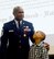 Evan Tubbs, son of Chief Master Sgt Lyndon Tubbs, 94th Airlift Wing, command chief, stands by his dad as he prepares to receive the Childs Medal during Tubbs retirement ceremony held on Dobbins Air Reserve Base, Ga., April 2, 2017, where he was honored for a 33 year successful career. (U.S. Air Force photo/Don Peek)