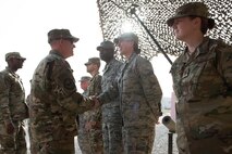 U.S. Air Force Vice Chief of Staff Gen. Stephen Wilson (left) shakes hands with Capt. Christina Nigro, 332nd Expeditionary Medical Group Operating Location Alpha chief nurse, during his visit to the 407th Air Expeditionary Group. The general’s primary topic of conversation while visiting with Airmen was how leadership can help Airman and make teams more resilient. (U.S. Air Force photo/Master Sgt. Benjamin Wilson)(Released)