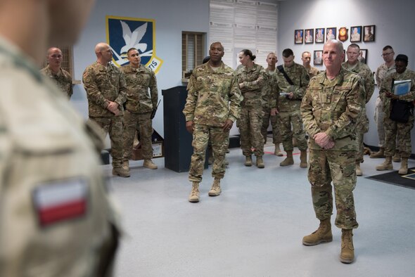U.S. Air Force Vice Chief of Staff Gen. Stephen Wilson (right) and Chief Master Sgt. of the Air Force Kaleth O. Wright (center) speak with a Polish Airmen assigned to the 407th Expeditionary Security Forces Squadron during their visit to the 407th Air Expeditionary Group April 8, 2017. Both Polish Airmen and U.S. Marines are integrated into the squadron to enhance the defense of joint and coalition assets on the installation. (U.S. Air Force photo/Master Sgt. Benjamin Wilson)(Released)