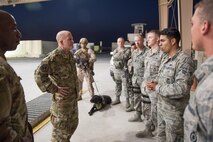 Chief Master Sgt. of the Air Force Kaleth O. Wright (left) and U.S. Air Force Vice Chief of Staff Gen. Stephen Wilson (center) speak with Senior Airman Jose Roque, 407th Expeditionary Security Forces Squadron, during their visit to the 407th Air Expeditionary Group April 8, 2017. During the visit the chief reminded Airmen, “you don’t become the greatest Air Force that ever existed by just waking up and putting on the uniform. You have to continue to work at it making yourself better.” (U.S. Air Force photo/Master Sgt. Benjamin Wilson)(Released)