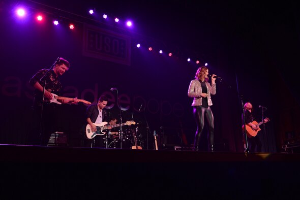 Cassadee Pope and her band perform during a USO-sponsored concert April 8, 2017, at the Ernie Walker Theater on Eielson Air Force Base, Alaska. Pope performed for the Icemen Team and their families for free in her very first USO concert. (U.S. Air Force photo by Airman 1st Class Cassandra Whitman)