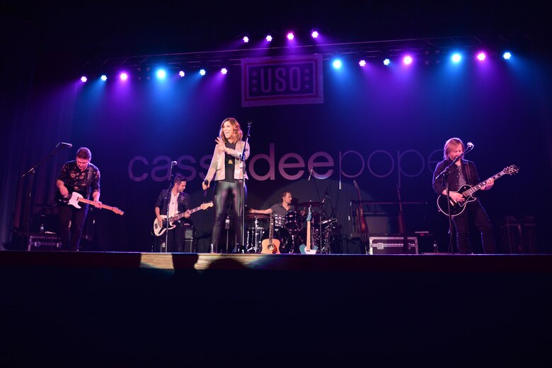 Cassadee Pope enters the stage at the Ernie Walker Theater April 8, 2017, on Eielson Air Force Base, Alaska. Pope performed her first USO tour, with Eielson being her very first stop. (U.S. Air Force photo by Airman 1st Class Cassandra Whitman)