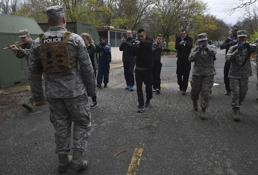 Staff Sgt. Juan Garcia, 11th Security Forces Squadron combat arms instructor, supervises University of Maryland ROTC students during training at Joint Base Andrews, Md., April 1, 2017. Approximately 120 students attended the training. (U.S. Air Force photo by Senior Airman Mariah Haddenham)