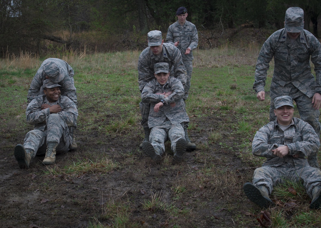 Senior Airman Gregory Hettenbach (back), 11th Security Forces Squadron emergency services team responder, supervises University of Maryland ROTC students during training at Joint Base Andrews, Md., April 1, 2017. The students practiced entry control point challenging and procedures, combat medical readiness, tactical movements, and land navigation. (U.S. Air Force photo by Senior Airman Mariah Haddenham)