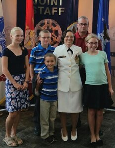 SUFFOLK, Va. - Karen Wingeart – the 2016 Naval Sea Systems Command (NAVSEA) Women Moving Forward Award winner – is pictured with her family upon her recent retirement from the Navy reserves. NAVSEA Commander Vice Adm. Thomas Moore announced Wingeart as the award winner in an April 2017 communiqué to NAVSEA employees based at Navy warfare centers and shipyards across the country. The Women Moving Forward award recognizes the contributions of individuals who promote equal opportunity in the workforce and continually make significant positive impacts to the command's mission and readiness. Wingeart - a the Navy's expert on Cooperative Engagement Capability systems for Ship Self-Defense Systems - served as a surface warfare officer and a meteorology and oceanography officer in her 20-year Navy career – 11 years on active duty and nine years in the reserves.