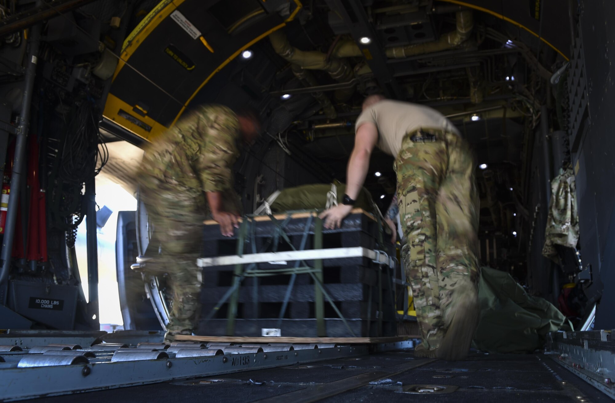 Loadmasters with the 15th Special Operations Squadron transport a container delivery system onto an MC-130 Combat Talon II at Hurlburt Field, Fla., April 7, 2017. The container delivery system is the most commonly used method for the quick, aerial insertion of supplies for military operations ensuring global reach anytime, anyplace. (U.S. Air Force photo by Airman 1st Class Joseph Pick)