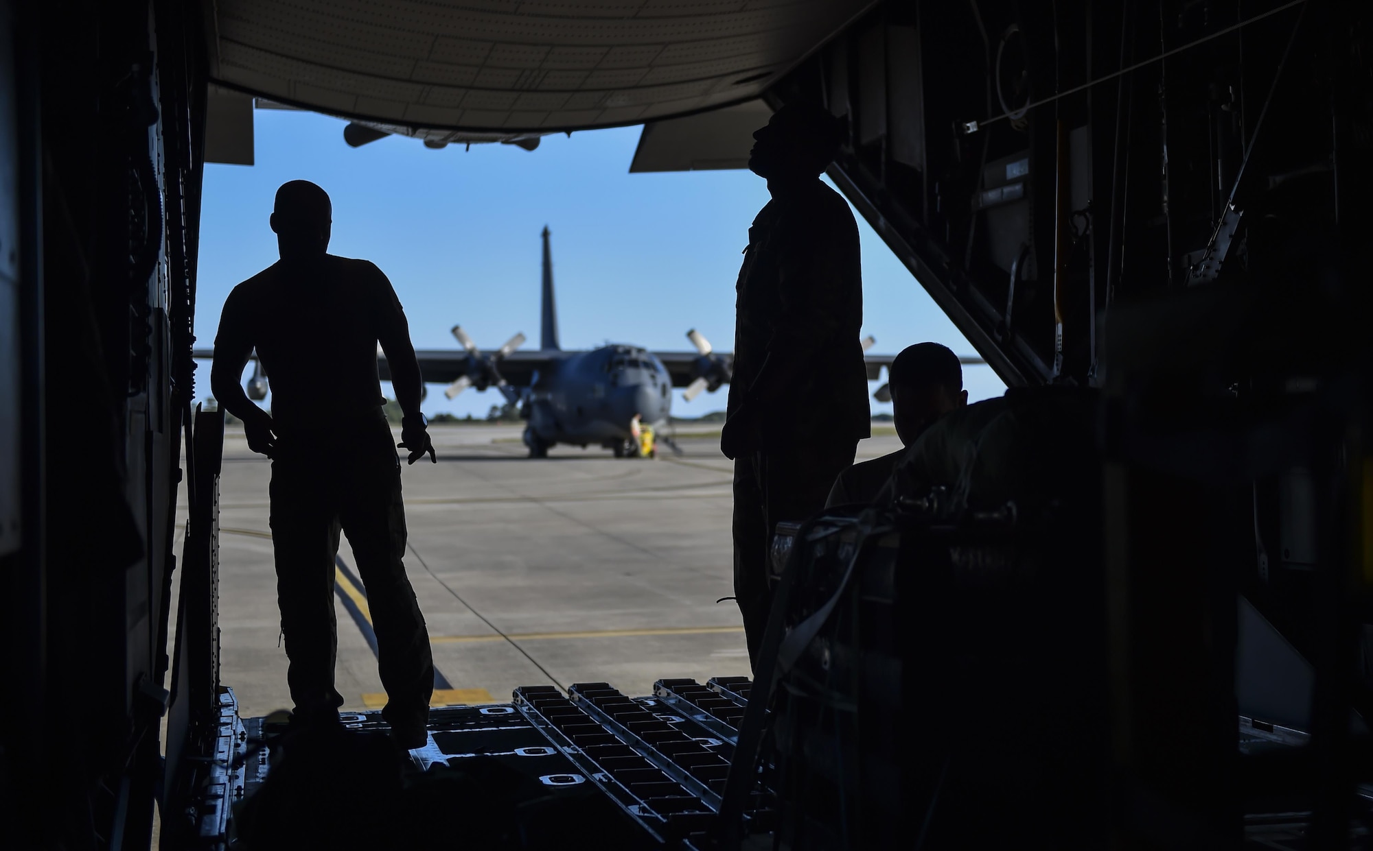 Loadmasters with the 15th Special Operations Squadron secure pallets on an MC-130 Combat Talon II at Hurlburt Field, Fla., April 7, 2017. Loadmasters are responsible for properly loading, securing and escorting cargo and passengers before and during flights. (U.S. Air Force photo by Airman 1st Class Joseph Pick)