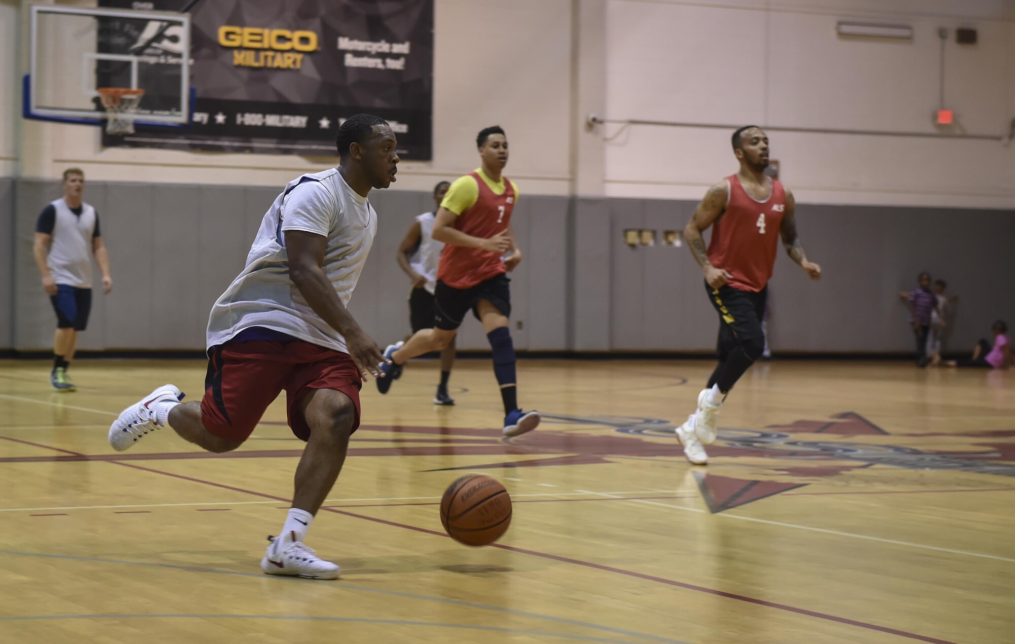 A member of the 1st Special Operations Civil Engineer Squadron basketball team, dribbles a basketball down court during the intramural basketball championship at the Aderholt Fitness Center on Hurlburt Field, Fla., April 6, 2017. The 1st SOCES bested the 1st Special Operations Medical Group by the score of 49 to 43. (U.S. Air Force photo by Airman 1st Class Joseph Pick)