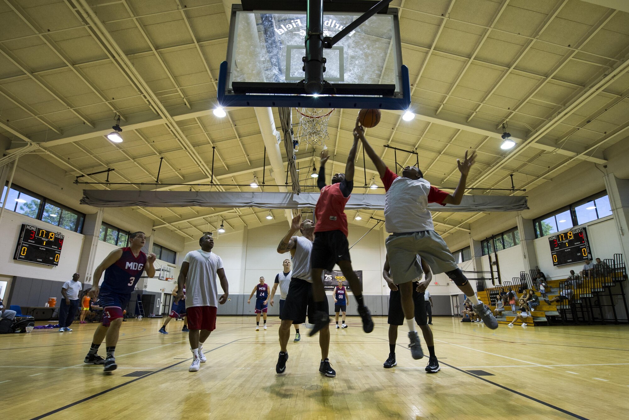 A member of 1st Special Operations Medical Group basketball team attempts a layup during the intramural basketball championship at the Aderholt Fitness Center on Hurlburt Field, Fla., April 6, 2017. For eight-weeks, 12 teams competing through a single-elimination tournament to qualify for the championship game. (U.S. Air Force photo by Airman 1st Class Joseph Pick)