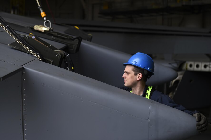Senior Airman Robert Hadwin, 62nd Maintenance Squadron maintenance flight repair and reclamation technician, assists in hoisting a C-17 Globemaster III flap April 6, 2017, at Joint Base Lewis-McChord, Wash. As it was the first flap change on McChord Field, the changing of the flap provided Airmen a valuable training opportunity. (U.S. Air Force photo/Tech. Sgt. Tim Chacon) 