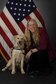 U.S. Air Force civilian Shellie Severa, the 354th Fighter Wing Sexual Assault Prevention and Response (SAPR) head victim advocate, poses with Tessa, the first SAPR K-9, April 6, 2017, at Eielson Air Force Base, Alaska. Severa is a certified K-9 trainer, serves as Tessa’s primary handler and has been working as a victim advocate for 9 years. (U.S. Air Force photo by Staff Sgt. Ashley Nicole Taylor)