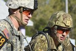 Army Staff Sgt. Erich Friedlein, left, with the Pennsylvania Army National Guard, and Army Capt. Robert Killian, with the Colorado Army National Guard, teammates during the Lt. Gen. David E. Grange Best Ranger Competition, review the requirements of their next event while taking part in the competition April 7, 2017, at Fort Benning, Georgia. Friedlein and Killian took first place in last year's competition, the first time an Army Guard team won the competition. This year's competition saw them take third place, with other Army Guard teams finishing in 10th and 18th place. 