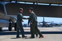 Barry Regula, 93rd Bomb Squadron honorary commander, shakes hands with the aircrew he flew with on a B-52 Stratofortress April 7, 2017 at Barksdale Air Force Base, La. The Honorary Commander Program allows civic leaders to partner with squadrons to build relationships in the local community. (U.S. Air Force photo by Master Sgt. Dachelle Melville/Released)  