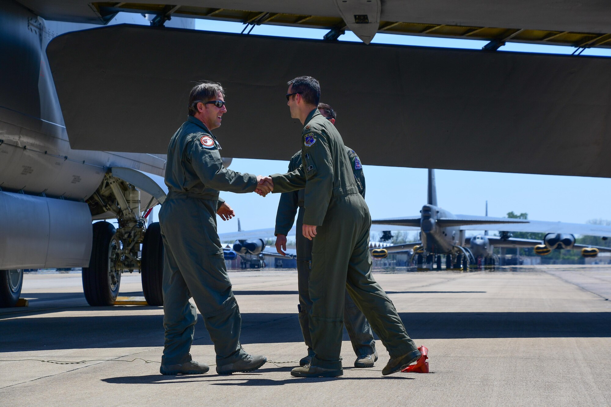 Barry Regula, 93rd Bomb Squadron honorary commander, shakes hands with the aircrew he flew with on a B-52 Stratofortress April 7, 2017 at Barksdale Air Force Base, La. The Honorary Commander Program allows civic leaders to partner with squadrons to build relationships in the local community. (U.S. Air Force photo by Master Sgt. Dachelle Melville/Released)  