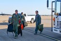 Col. Brent Weisner, 93rd Bomb Squadron commander and Barry Regula, 93rd BS honorary commander, depart the bus for their flight April 7, 2016 on the flight line of Barksdale Air Force Base, La. The Honorary Commanders Program pairs squadron commanders with local civic leaders to increase public awareness and understanding of the Air Force Reserve and its mission. (U.S. Air Force photo by Master Sgt. Dachelle Melville/Released)
