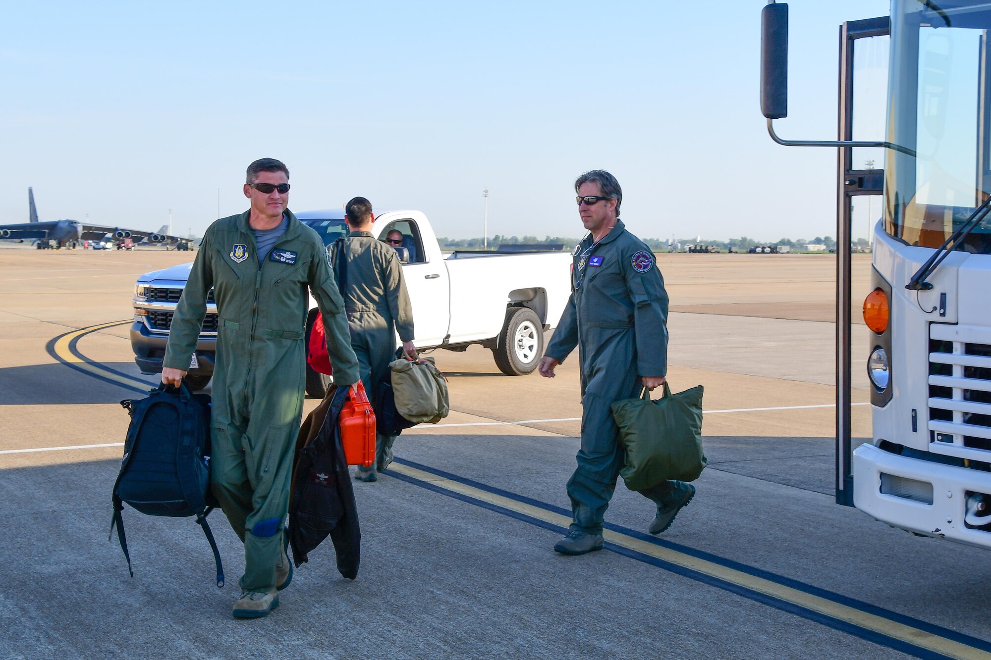 Col. Brent Weisner, 93rd Bomb Squadron commander and Barry Regula, 93rd BS honorary commander, depart the bus for their flight April 7, 2016 on the flight line of Barksdale Air Force Base, La. The Honorary Commanders Program pairs squadron commanders with local civic leaders to increase public awareness and understanding of the Air Force Reserve and its mission. (U.S. Air Force photo by Master Sgt. Dachelle Melville/Released)