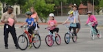 Children ages 8-13 years old line up to put their bicycle riding skills to a test against one another April 8. The Bicycle Rodeo program targets elementary and middle school students to provide bicycle safety information and guidance. Bike rodeo is an opportunity for kids and adults to increase their riding skills by negotiating several obstacles and/or tracks, testing their riding abilities. Individuals also got the opportunity to get their bike inspected, tuned up and bike registered.