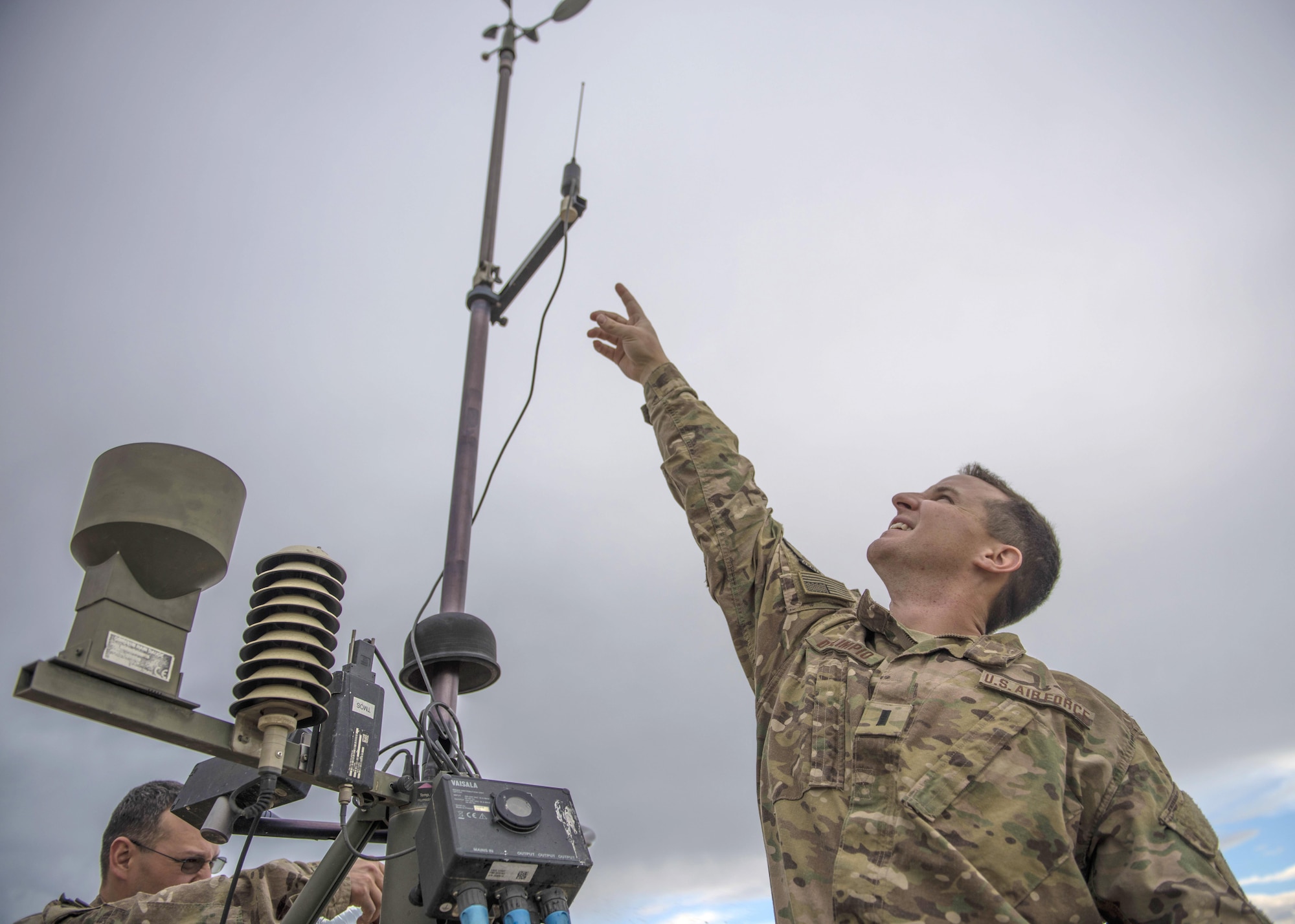 1st Lt. Justin D'olimpio, 455th Expeditionary Operations Support Squadron weather flight commander, points at a Tactical Meteorological Observation System, or TMQ-53, at Bagram Airfield, Afghanistan, May 16, 2016. Global weather stations like these feed meteorological data collection efforts logged by Airmen at the 14th Weather Squadron in Asheville, North Carolina. (U.S. Air Force photo by Senior Airman Justyn M. Freeman)
