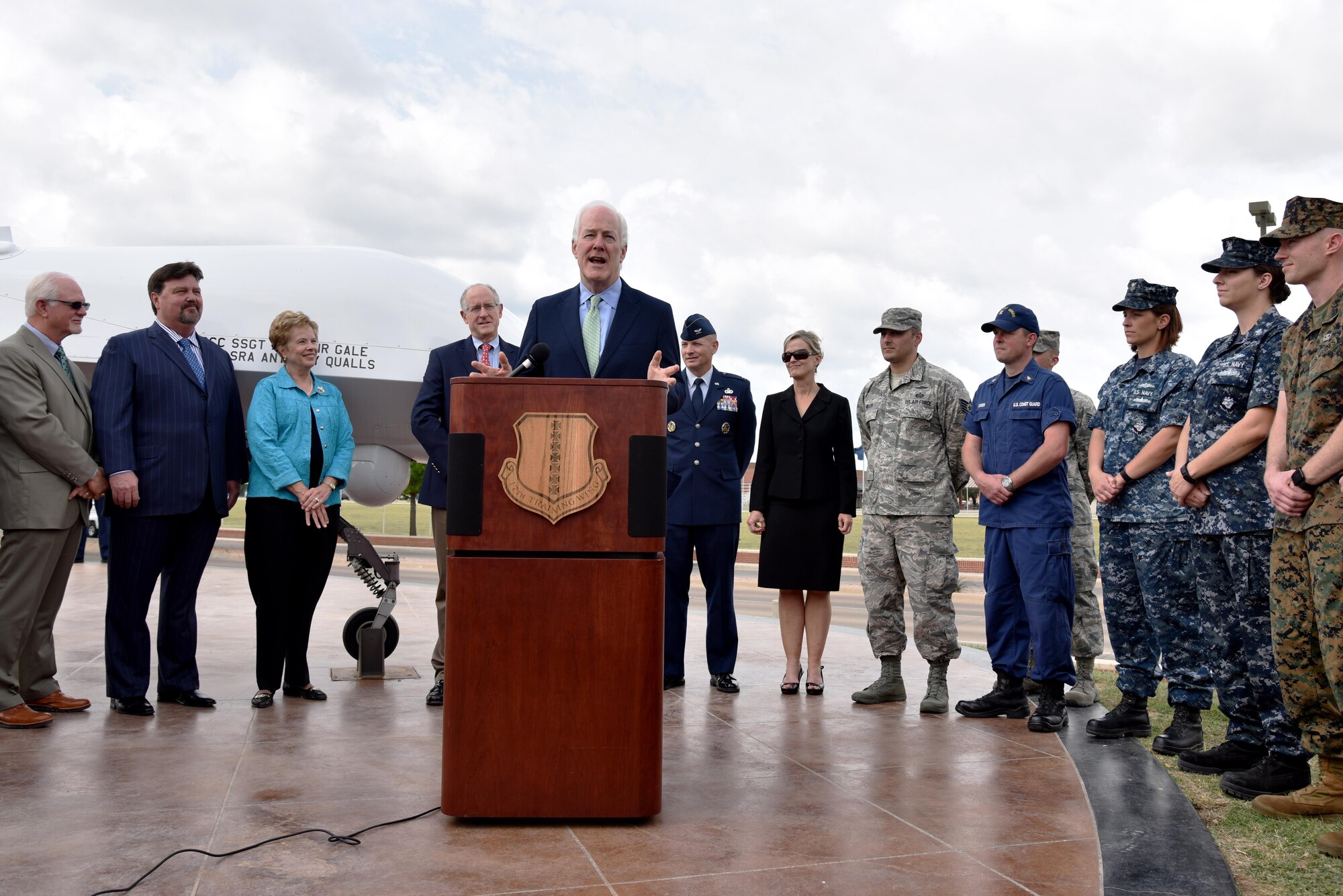 Sen. John Cornyn III, Senate Majority Whip for the 115th Congress, holds a press conference at the RQ-1 Predator aircraft display on Goodfellow Air Force Base, Texas, April 10, 2017. During his conference he talked about the importance of Goodfellow on the local community, Texas and America. (U.S. Air Force photo by Staff Sgt. Joshua Edwards/Released)