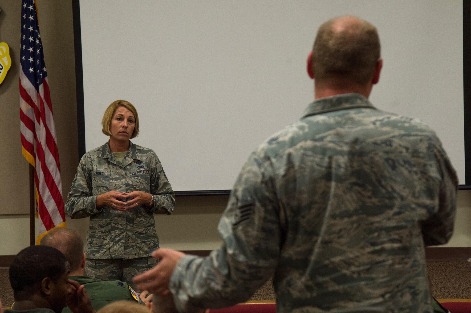 U.S. Air Force Chief Master Sgt. Melanie Noel, command chief of the 6th Air Mobility Wing, listens as a 99th Air Refueling Squadron staff sergeant explains his perspective on the new promotion system during a commander’s call at Birmingham Air National Guard Base, Ala., April 4, 2017. The chief, joined by the wing’s vice commander, operations group commander and superintendent, spoke with the Airmen of the 99th ARS to see how they can better serve them moving forward.