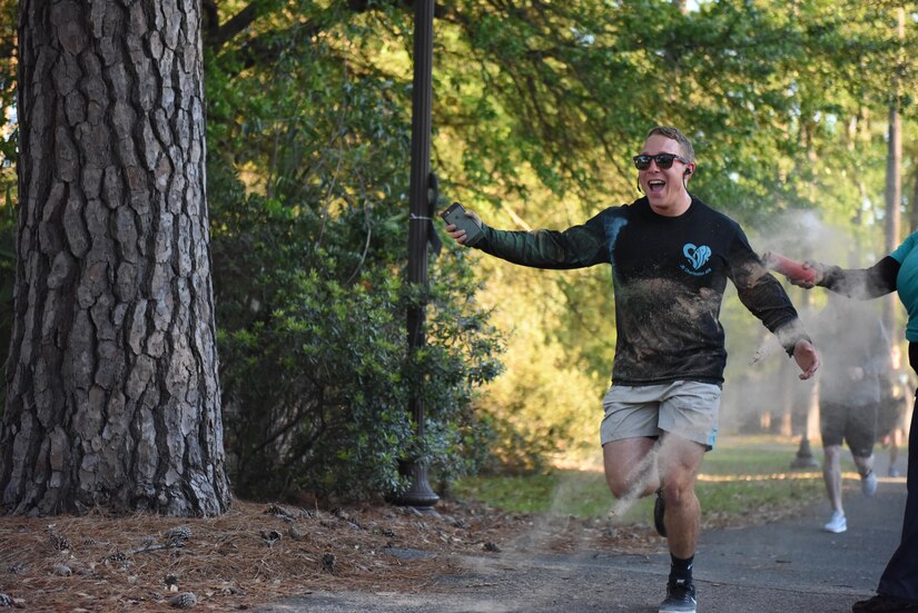 Airman 1st Class Dylan Rumsey, 628th Logistics Readiness Squadron inventory apprentice, participates in a color run hosted by the Sexual Assault Prevention and Response office, at Joint Base Charleston, South Carolina April 7, 2017. The run was held as part of Sexual Assault Awareness and Prevention Month, which focuses on creating an appropriate culture to eliminate sexual assault.